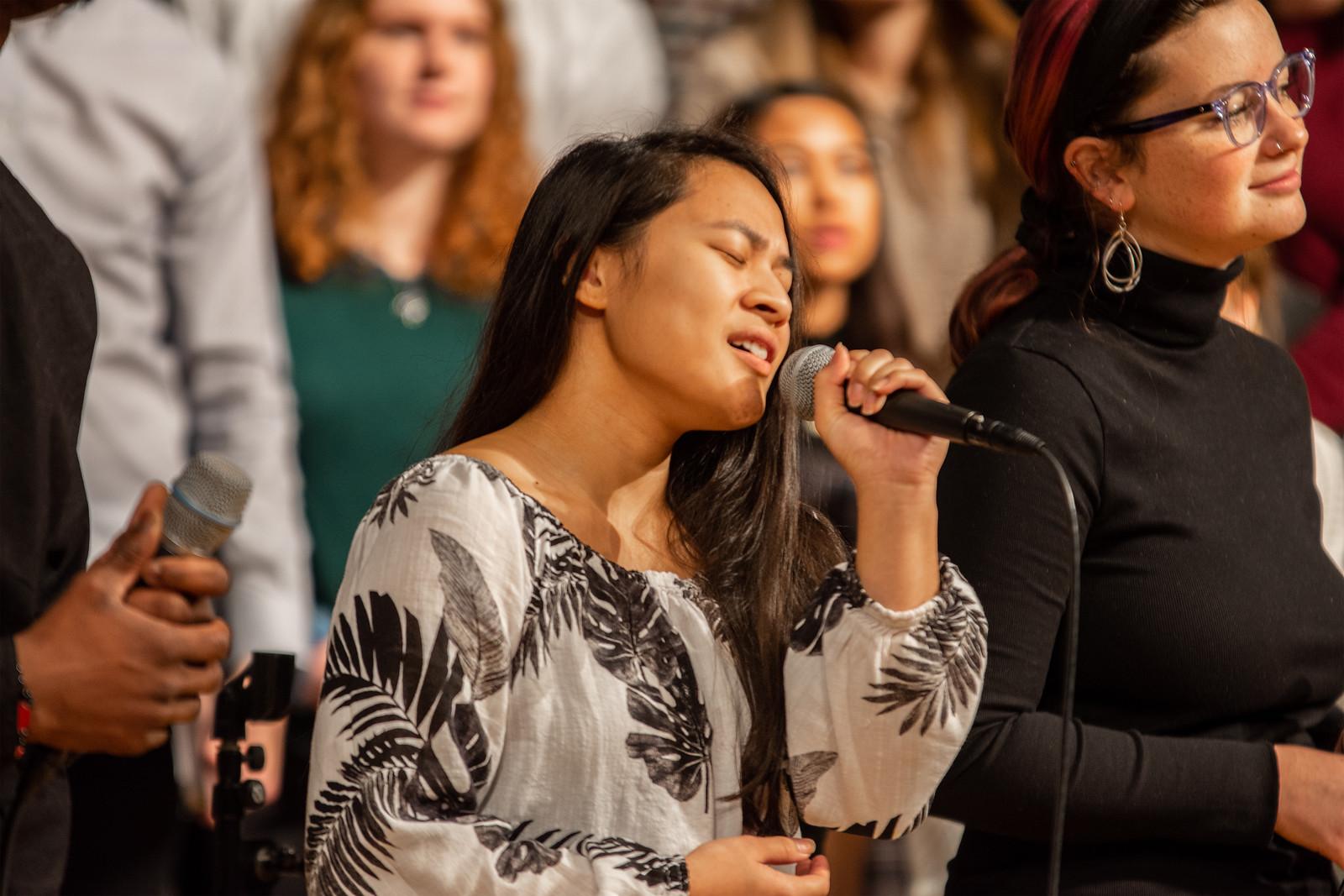 SPU student on the Worship Team singing in Chapel